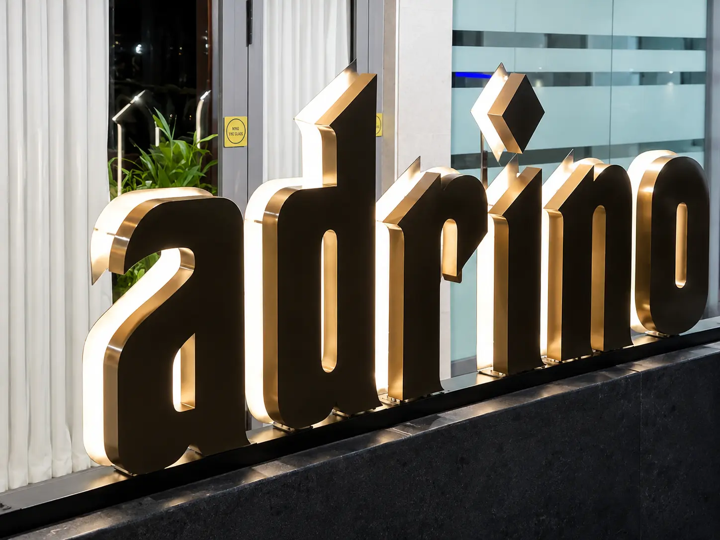 Illuminated LED dimensional signage glowing at night
