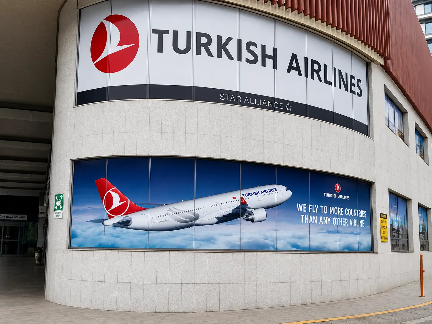Turkish Airlines window graphics and logo on a curved building facade
