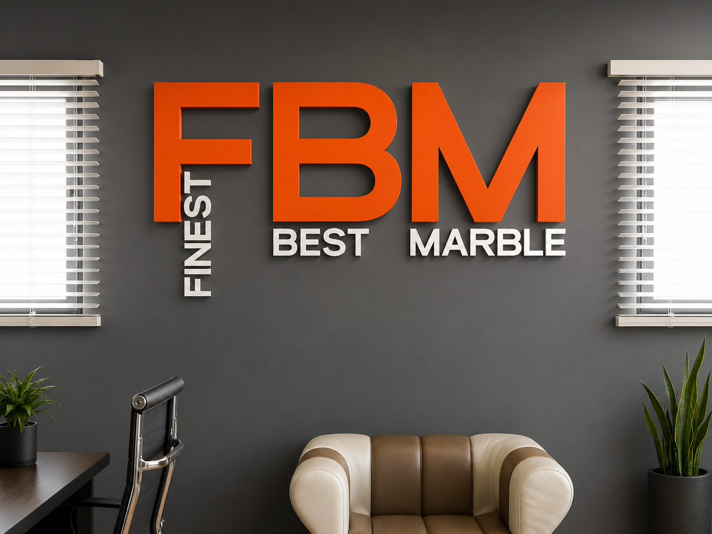 Large orange and white FBM dimensional lettering on a dark office wall